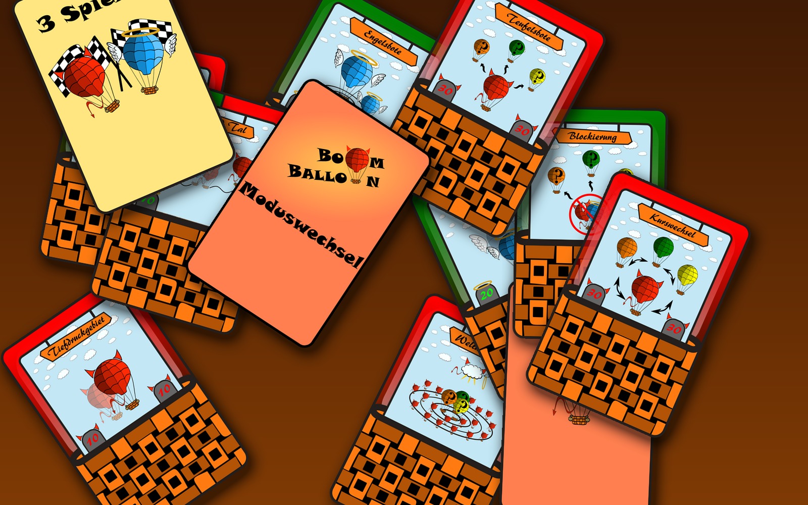 A scattered spread of printed Boom Balloon cards — Weltuntergang, Blockierung, Yin Yang, and others.