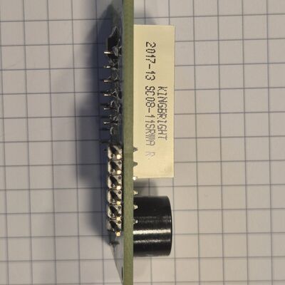 Assembled Displaymodul edge on, with the 6-pin header and the display's part label.